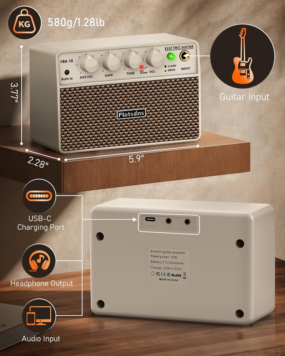 Flatsons FBA-10 white battery powered guitar amplifier sitting on a picnic table with an electric guitar and sunglasses on a sunny day